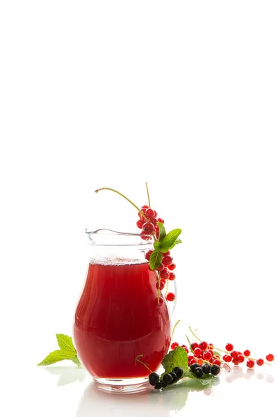 fresh berry juice from red and black currant, isolated on white background