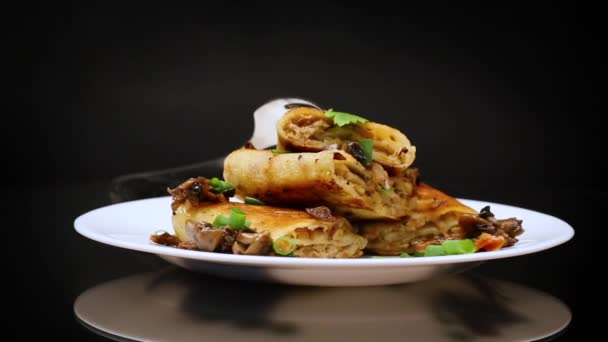 Fried Thin Pancakes Stuffed Meat Mushrooms Plate Isolated Black Background — Stock Video