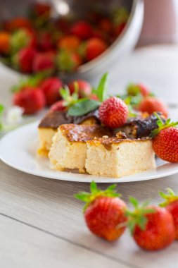 prepared cottage cheese casserole with fresh strawberries .