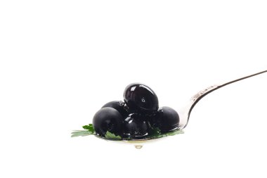 black olives in a spoon isolated on a white background. clipart