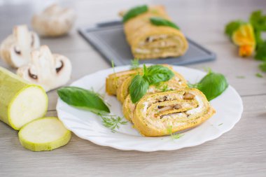 Masada peynir ve mantarlı kabak rulosu..