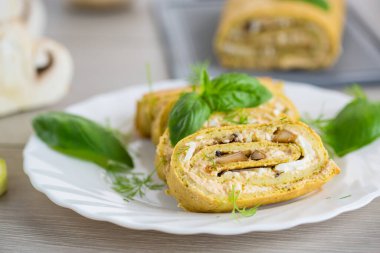 Fırında mantar ve peynirli kabak sarması..