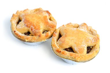 Cranberry and chocolate mince pies isolated on white background.