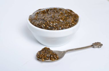Chia seeds caviar with laminaria on white background.