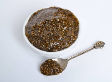 Chia seeds caviar with laminaria on white background.