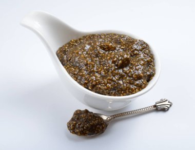 Chia seeds caviar with laminaria on white background.