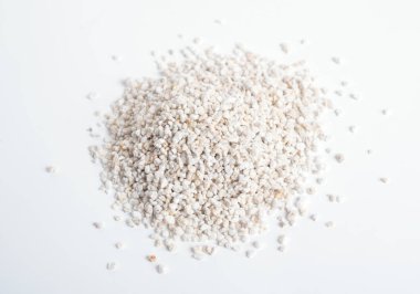 Heep of Expanded perlite on white background.