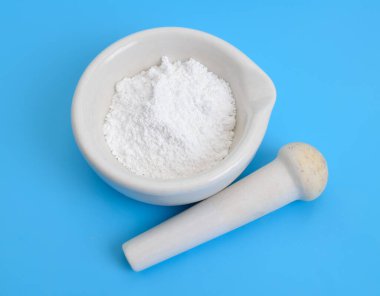 Magnesium oxide MgO, or magnesia powder. clipart