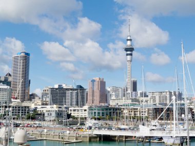 AUCKLAND, NZ, APR 16, 2012: Skyline of Auckland Central Business District with Sky Tower with Viaduct Harbor, on 16 Nisan 2012, Auckland, Yeni Zelanda