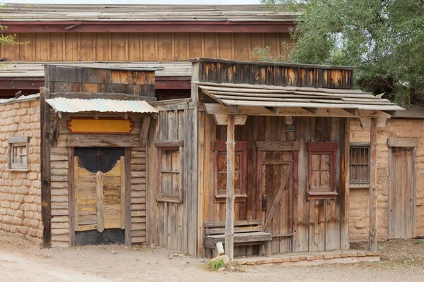 Historic saloon boarded up front door mud brick shack facade of vintage building near Tucson, Arizona, AZ, USA