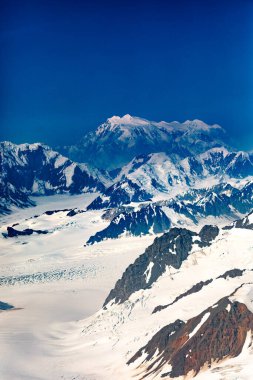 Mount Logan towering over St. Elias mountains icefield Kluane National Park, highest mountain peak of Canada, Yukon Territory near Haines Junction clipart