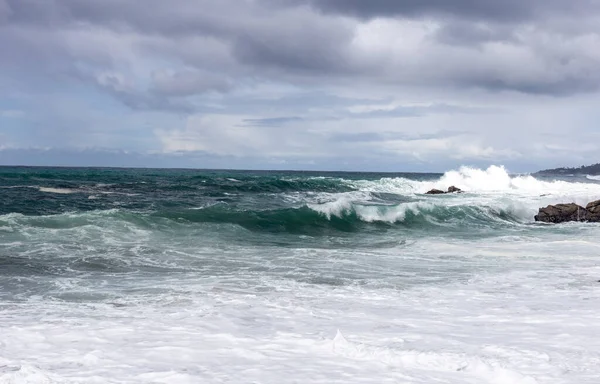 stormy waves crashing on the beach