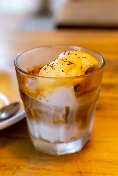 stock image ice cream in glass on wooden table