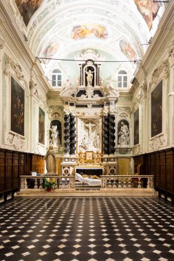 Ventimiglia, Italy - August 2022: the baroque church interior of Oratorio dei Neri with Jesus Christ statue clipart