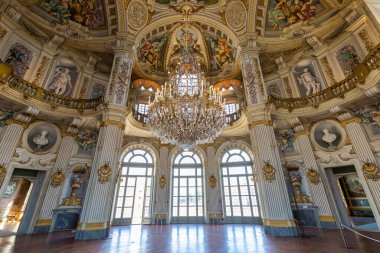Italy, Stupinigi - January 2023: luxury interior of Royal Palace with baroque marbles and windows