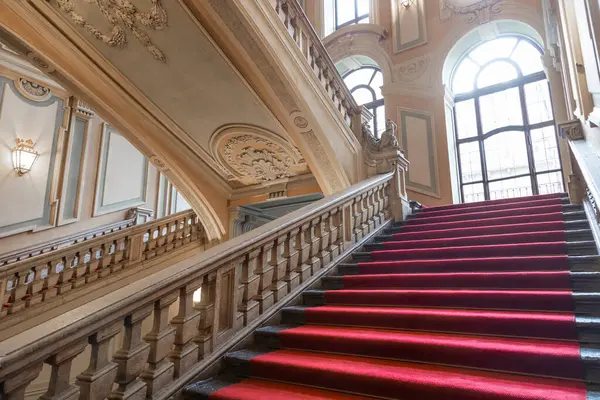 Turin, Italy - January 2023: Palazzo Barolo staircase. Luxury palace with old baroque interior and red carpet