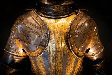 Antique armour on black background. Concept for security, safety and fantasy