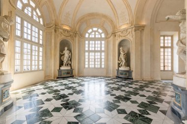 Venaria Reale, Italy - January 2023: luxury interior old royal palace. Gallery perspective with window