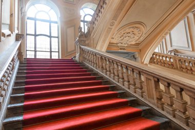 Turin, Italy - January 2023: Palazzo Barolo staircase. Luxury palace with old baroque interior and red carpet