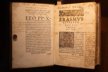 Turin, Italy - 22 April 2023: Erasmo da Rotterdam - Erasmus Roterodamus - New Testament, first printed in 1516 clipart