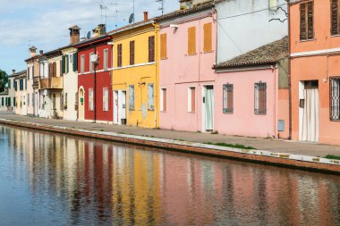 Comacchio, Italy - 11 July 2024: traditional colored buildings in Comacchio village, named the Little Venice clipart