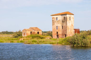 Italy, Comacchio lagoon with blue sky. Panorama with country and canals. clipart