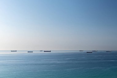 Cargo ships waiting in line to enter the port of Tarragona in the Mediterranean coast.