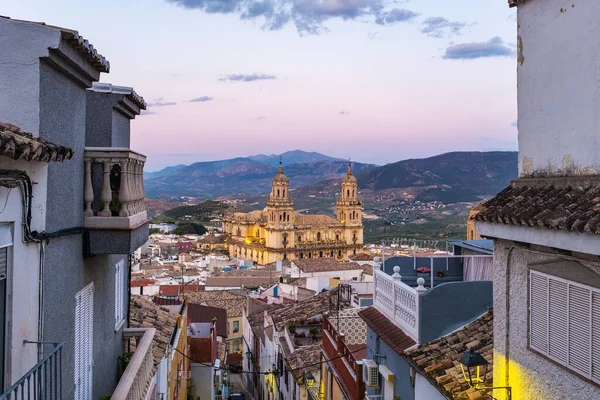 stock image Cityscape of the Andalusian city of Jaen at dusk, with the cathedral to be recognized among the rooftops.