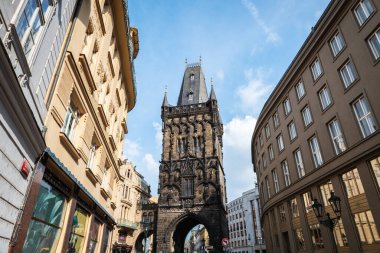 PRAGUE, CZECH REPUBLIC - AUGUST 24, 2022: Wide-angle view of the Gothic Powder Tower in Prague, one of the original city gates. clipart