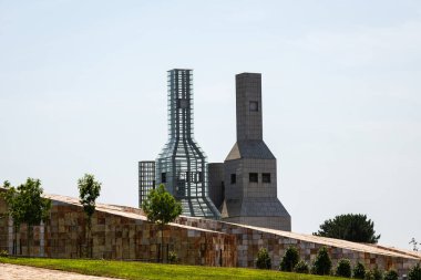 SANTIAGO, SPAIN - JULY 17, 2022: Modern architecture of Gaias, the City of Culture (Cidade da Cultura) in Santiago de Compostela, Galicia, a complex of cultural buildings designed by a group of architects led by Peter Eisenman. clipart