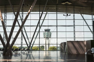 SANTIAGO, SPAIN - JULY 17, 2022: Interior view of the sleek and contemporary architecture within the departure concourse at Santiago de Compostela Airport in Galicia, Spain. clipart