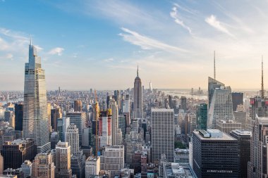 NEW YORK CITY - MAY 23, 2024: Aerial view of the Empire State Building and downtown Manhattan at dusk, New York City. clipart