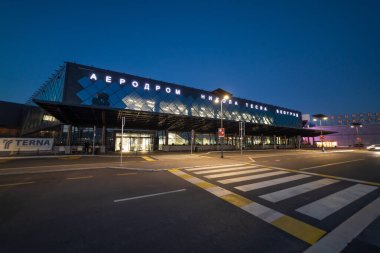 International Airport Nikola Tesla in Belgrade, Serbia, sunset, departures gate clipart