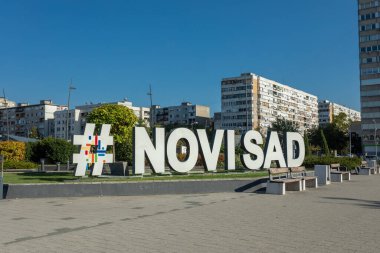 Novi Sad, Serbia - September 10, 2023: Title and hashtag Novi Sad in front of the Promenada shopping mall in Novi Sad, Serbia clipart