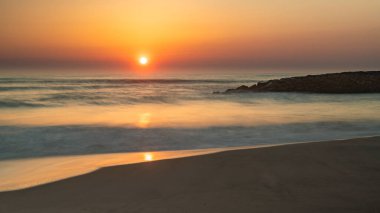 Landscape of Furadouro beach, Portugal at sunset. clipart