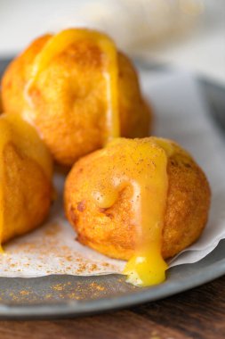 Rabanada 's poveiras with egg cream and tarnamon on on a kitchen counter during the Christmas season.