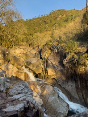 Water stream near Fecha de Barjas waterfall (also known as Tahiti waterfall) in the mountains of Peneda-Geres National Park, Portugal.
