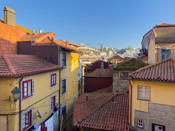 PORTO, PORTUGAL - CIRCA APRIL 2023: Narrow streets in Oporto city in Portugal. The historic centre of Porto was designated a UNESCO World Heritage site in 1996.