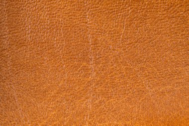 Detaylı kahverengi deri doku arkaplanının yakınlaştırılması.