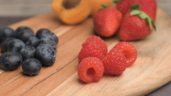 Wooden Board Fresh Organic Fruit Berries Strawberries Black Blueberries Apricot — Stock Photo, Image