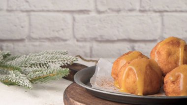 Rabanada 's poveiras with egg cream and tarnamon on on a kitchen counter during the Christmas season.