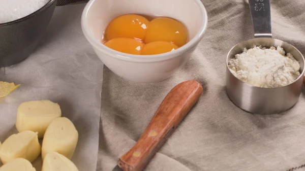 Egg tarts, traditional portuguese dessert, pastel de nata, custard tarts home production ingredients.
