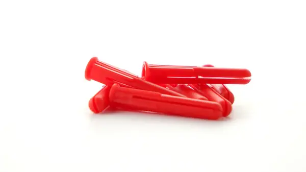 Red Plastic Dowels Isolated White Background — Stock Photo, Image