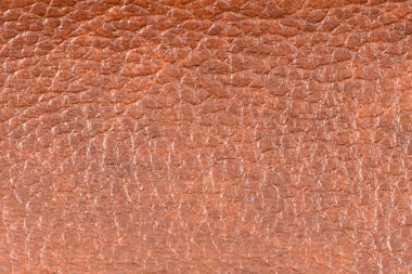 Detaylı kahverengi deri doku arkaplanının yakınlaştırılması.