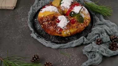 Bolo Rei or Kings Cake is a traditional Xmas cake with fruits raisins nut and icing on kitcthen countertop. Is made for Christmas, Carnavale or Mardi Gras