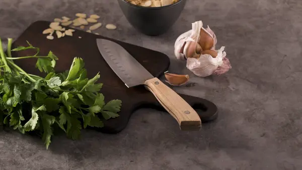 Fresh Garden Herbs Kitchen Countertop Parsley Garlic Knife Almons Concept Royalty Free Stock Photos
