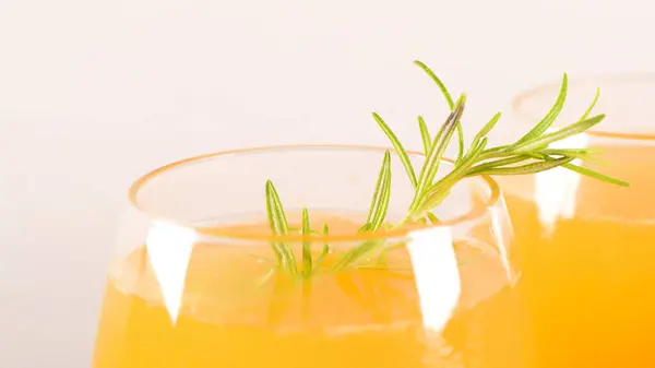 Homemade Peach Juice Ice Cubes Rosemary Leaves Glass Marble Stone Royalty Free Stock Photos