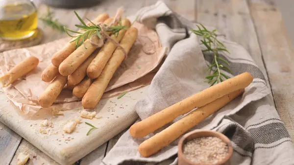 Traditional Italian Breadsticks Grissini Rosemary Olive Oil Sesame Seeds Wooden kuvapankin valokuva