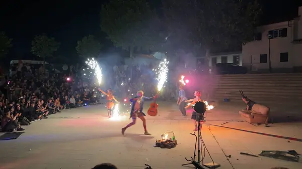 stock image Ovar, Portugal - July 31, 2024: French jugglers of Circuencia perform at night with fire.