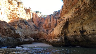 Summer Atlantic ocean rocky coastline near Carvoeiro town, Lagoa, Algarve - Portugal. clipart